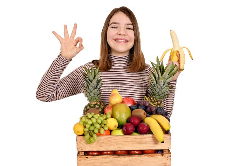 Flicka med banan och ok-skylt arkivbilder