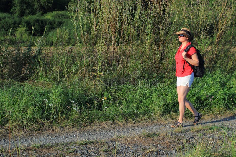 Women walking on the way in countryside. Women walking on the way in countryside.