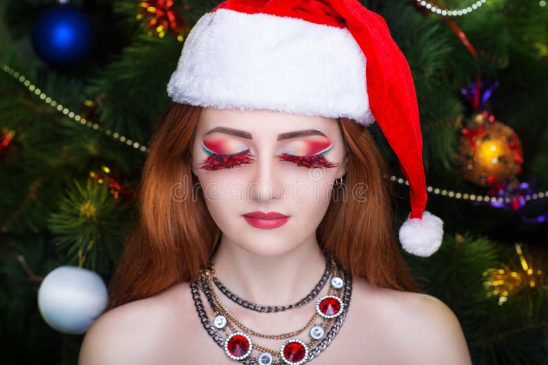 Flicka sexiga santa arkivfoton Flicka sexiga santa arkivfoton