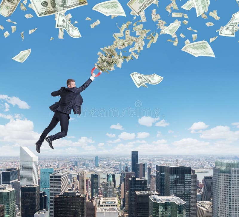 Fliegender überzeugter hübscher Geschäftsmann mit Magneten zieht Dollaranmerkungen an lizenzfreies stockbild Fliegender überzeugter hübscher Geschäftsmann mit Magneten zieht Dollaranmerkungen an lizenzfreies stockbild