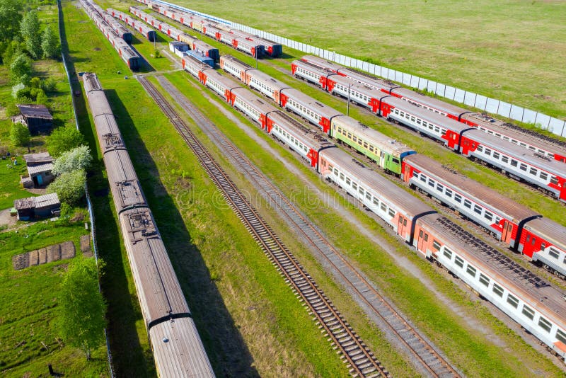 Flight Over Passenger Trains at Railway Station on a Summer Day Stock