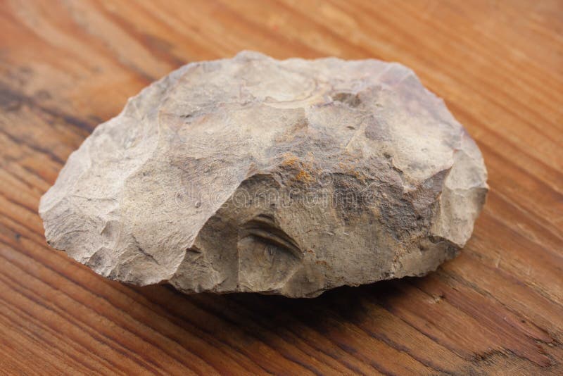 Piece of a flint stone, silex, used in prehistory as a tool. Stock Photo