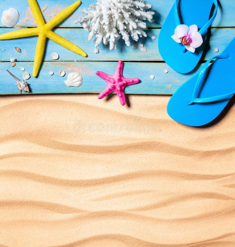 Flip-flop, starfish, seashells and coral on wooden and sand as beach background stock images