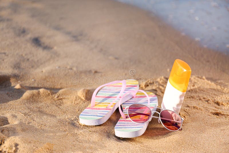 Flip Flops and Beach on Sand Near Sea. Space for Text Stock Photo ...