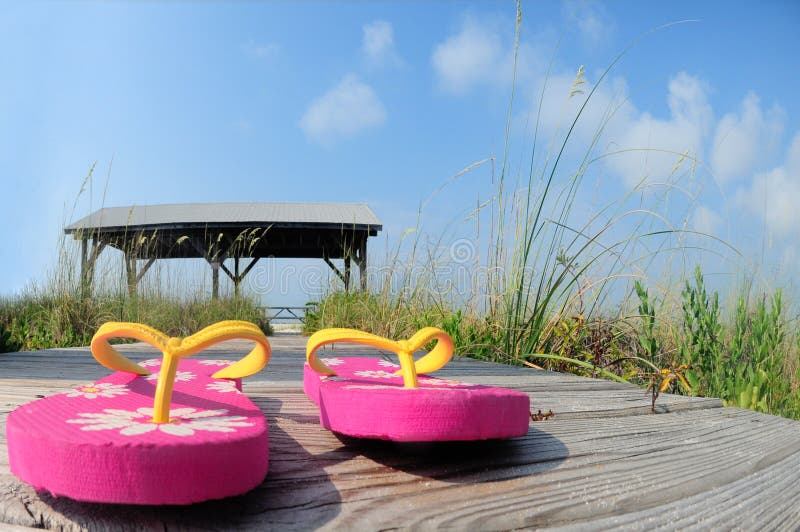 Flip Flops on Beach Boardwalk Stock Photo - Image of holiday, seashore