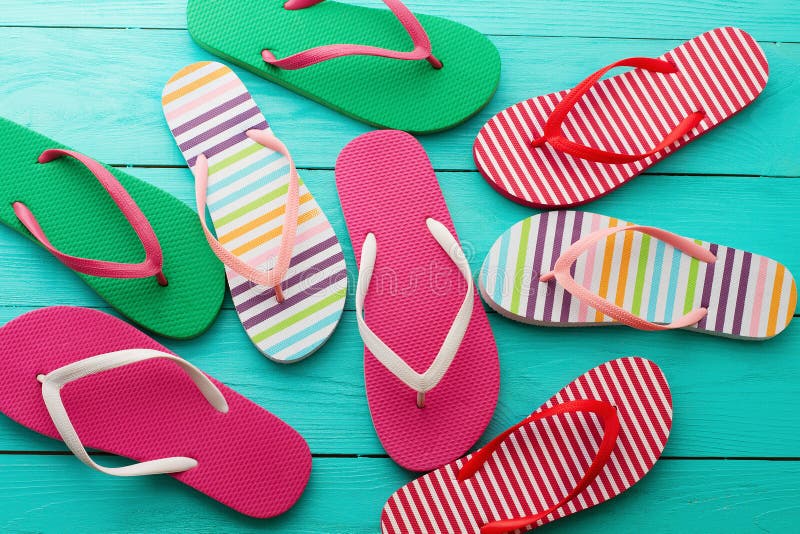 Flip flops on blue wooden floor background. Top view and copy space. Summer fun weekend royalty free stock photo Flip flops on blue wooden floor background. Top view and copy space. Summer fun weekend royalty free stock photo