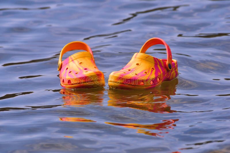 Flipflops Floating on the Water, in the Outdoors Stock Image Image of color, yellow 92722479