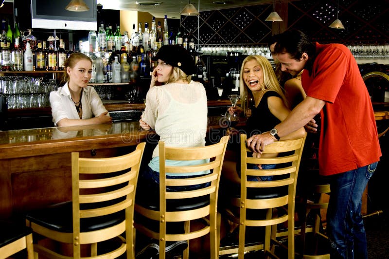 Flirting at the pub royalty free stock photography