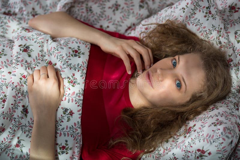 Flirty lonely girl in bed stock images Flirty lonely girl in bed stock images