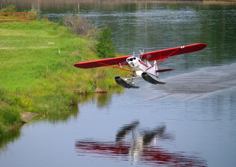 Float Plane Taking Off stock image. Image of floats, waves 5939617