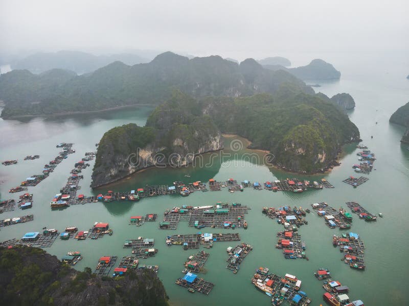 Floating fisherman\'s village in ha long bay, northern vietnam. top view, aerial view. A floating fisherman\'s village in ha long bay, northern vietnam. top view royalty free stock photography Floating fisherman\'s village in ha long bay, northern vietnam. top view, aerial view. A floating fisherman\'s village in ha long bay, northern vietnam. top view royalty free stock photography