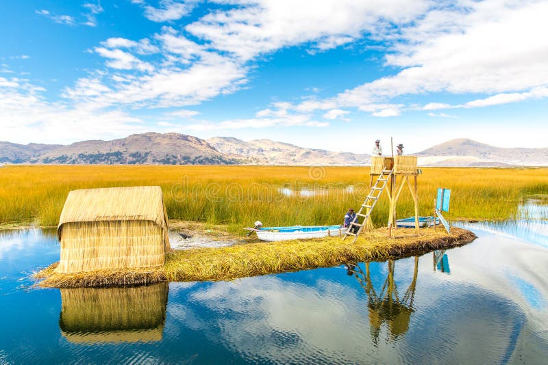 Floating Islands on Lake Titicaca Puno, Peru, South America, thatched home. Dense root that plants Khili interweave