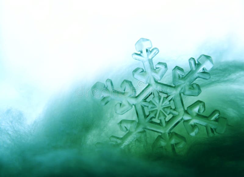 Aqua snowflake caught in snow drift. Aqua snowflake caught in snow drift