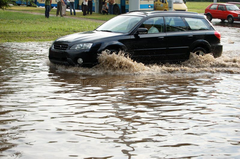 Car on flooding road. Car on flooding road