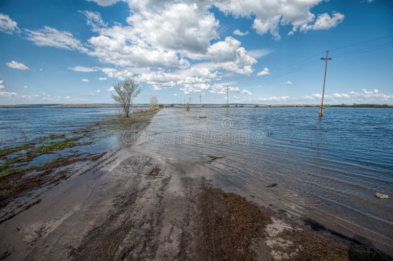 The flood of the river Don. Dangerous water level on the road towards Tryokhostrovskaya ferry station. royalty free stock photos The flood of the river Don. Dangerous water level on the road towards Tryokhostrovskaya ferry station. royalty free stock photos