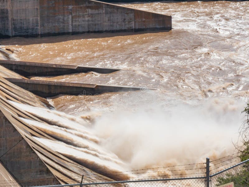 Floodgates open at an electrical power generation dam