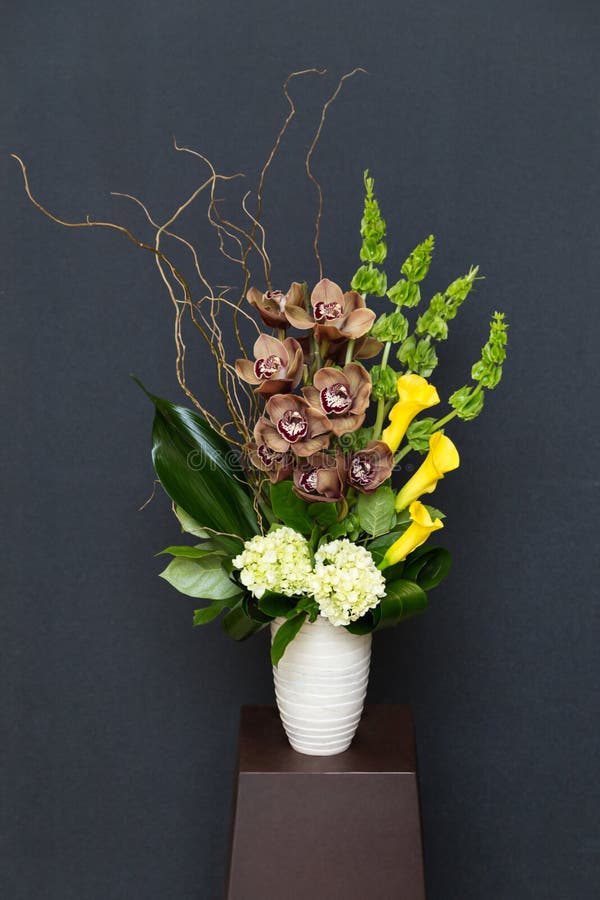 Floral arangement with Calla, cymbidium, Hydrangea, Orchids moluccella