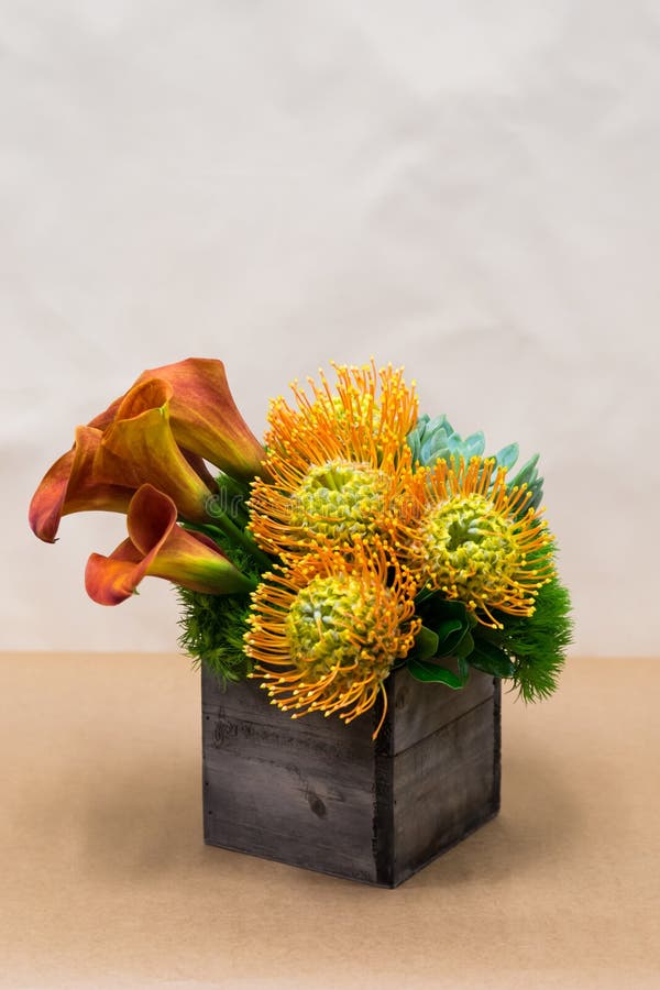 Floral arangement with Calla Lilies, Dianthus, succulent, protea