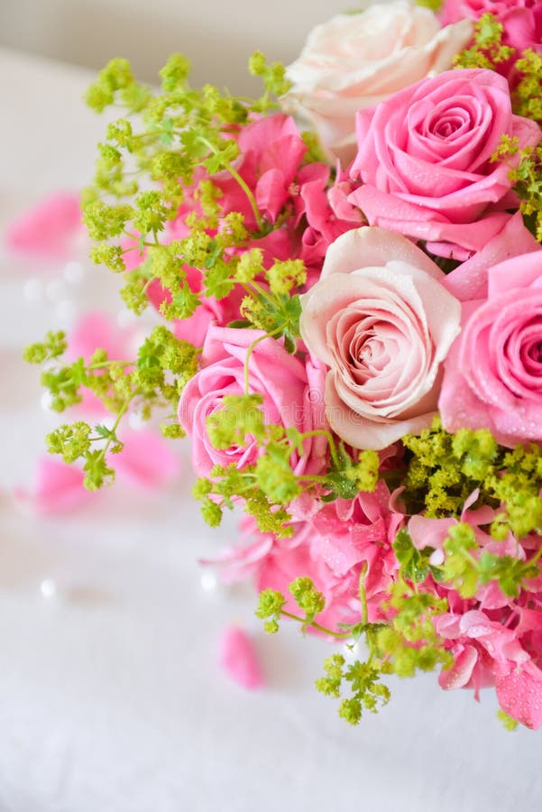 floral arrangement for interior decoration, table setting for a wedding or to create a home cosiness. use as background. pink roses