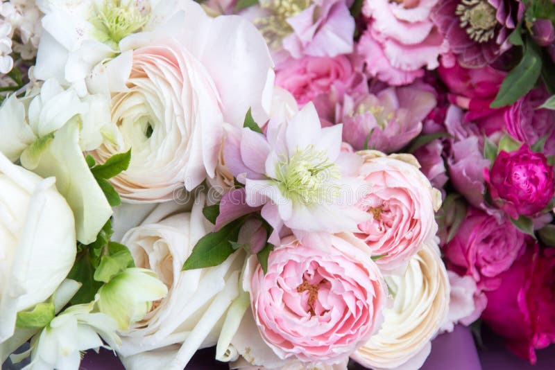 Beautiful rich elegant wedding bouquet, flowers arrangement by florist with white and pink roses