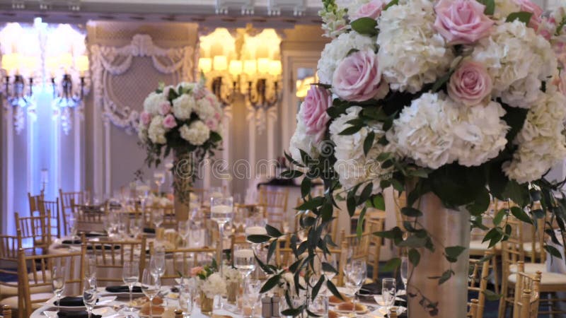 Floral Decoration on Wedding Tables in Luxury Event Venue. Bright Flower Bouquet