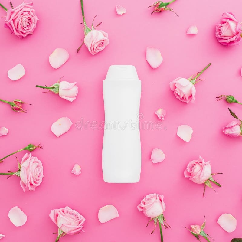 Floral frame of roses with petals and shampoo on pink background. Beauty concept. Flat lay, Top view. Floral frame of roses with petals and shampoo on pink royalty free stock photo Floral frame of roses with petals and shampoo on pink background. Beauty concept. Flat lay, Top view. Floral frame of roses with petals and shampoo on pink royalty free stock photo