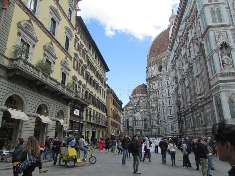 Florence, Italy, the central square. Crowds of tourists. On the left is the Catholic temple complex. stock photo Florence, Italy, the central square. Crowds of tourists. On the left is the Catholic temple complex. stock photo