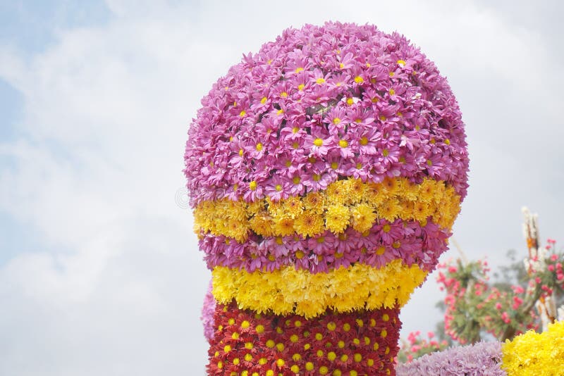 Pink, red and yellow chrysanthemum and daisy flowers arranged to resemble microphone displayed at flower festival in Baguio, Philippines, Southeast Asia. Photo taken on March 1, 2015. Pink, red and yellow chrysanthemum and daisy flowers arranged to resemble microphone displayed at flower festival in Baguio, Philippines, Southeast Asia. Photo taken on March 1, 2015.