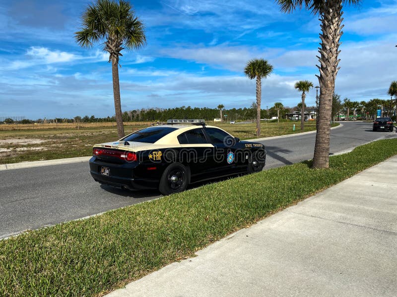 A Florida Highway Patrol car parked on a neighborhood street