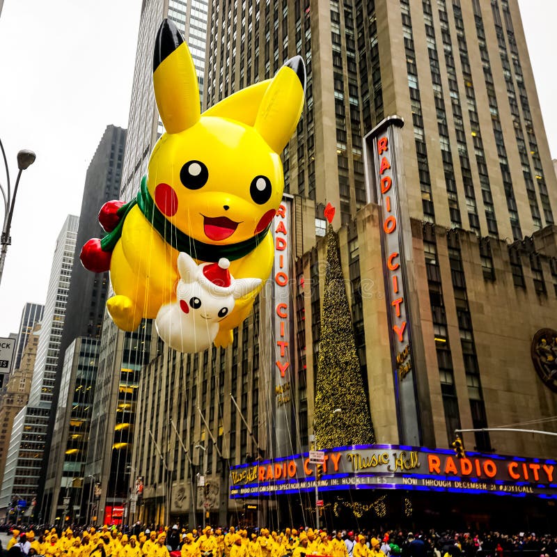 Pokemon Pikachu Est Assis Sur Un Petit Parapluie Avec Des Ballons Autour De  Lui.