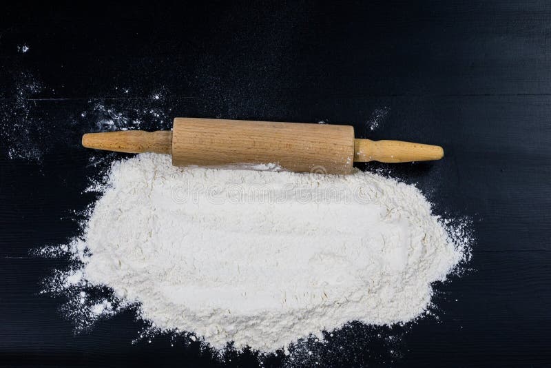 Flour And Rolling Pin For Kneading The Dough On The Kitchen Table