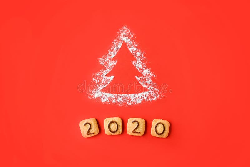 Flour Silhouette Christmas Tree with cookies digits 2020 on red background. Delicious bakery sweet confectionery Christmas card. Idea of merry new year xmas 2020 holiday, hand, date, happy, art, bright, brown, celebrations, decor, decoration, festive, holidays, number, objects, old, ornaments, retro, seasons, set, sigh, sign, star, style, symbol, texture, twine, vintage, winter, wooden. Flour Silhouette Christmas Tree with cookies digits 2020 on red background. Delicious bakery sweet confectionery Christmas card. Idea of merry new year xmas 2020 holiday, hand, date, happy, art, bright, brown, celebrations, decor, decoration, festive, holidays, number, objects, old, ornaments, retro, seasons, set, sigh, sign, star, style, symbol, texture, twine, vintage, winter, wooden