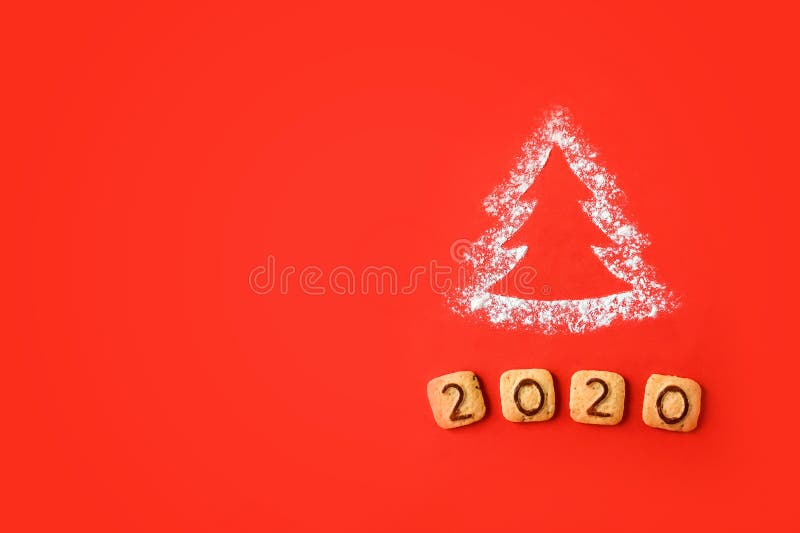 Flour Silhouette Christmas Tree with cookies digits 2020 on red background. Delicious bakery sweet confectionery Christmas card. Idea of merry new year xmas 2020 holiday, hand, date, happy, art, bright, brown, celebrations, decor, decoration, festive, holidays, number, objects, old, ornaments, retro, seasons, set, sigh, sign, star, style, symbol, texture, twine, vintage, winter, wooden. Flour Silhouette Christmas Tree with cookies digits 2020 on red background. Delicious bakery sweet confectionery Christmas card. Idea of merry new year xmas 2020 holiday, hand, date, happy, art, bright, brown, celebrations, decor, decoration, festive, holidays, number, objects, old, ornaments, retro, seasons, set, sigh, sign, star, style, symbol, texture, twine, vintage, winter, wooden