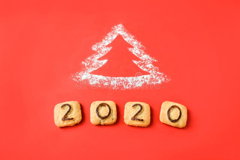 Flour Silhouette Christmas Tree with cookies digits 2020 on red background. Delicious bakery sweet confectionery Christmas card. Idea of merry new year xmas 2020 holiday, hand, date, happy, art, bright, brown, celebrations, decor, decoration, festive, holidays, number, objects, old, ornaments, retro, seasons, set, sigh, sign, star, style, symbol, texture, twine, vintage, winter, wooden. Flour Silhouette Christmas Tree with cookies digits 2020 on red background. Delicious bakery sweet confectionery Christmas card. Idea of merry new year xmas 2020 holiday, hand, date, happy, art, bright, brown, celebrations, decor, decoration, festive, holidays, number, objects, old, ornaments, retro, seasons, set, sigh, sign, star, style, symbol, texture, twine, vintage, winter, wooden