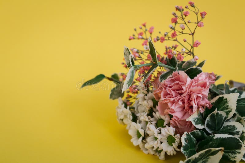 Flower bouquet in blossom on yellow background. Can be used for wedding, mother day, valentine stock image Flower bouquet in blossom on yellow background. Can be used for wedding, mother day, valentine stock image