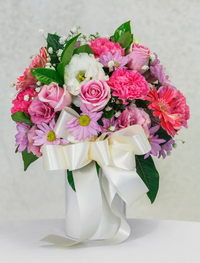 Flower bouquet in white ceramic vase