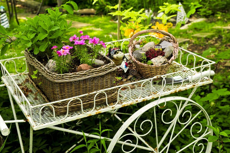 Flower cart in garden stock photography Flower cart in garden stock photography