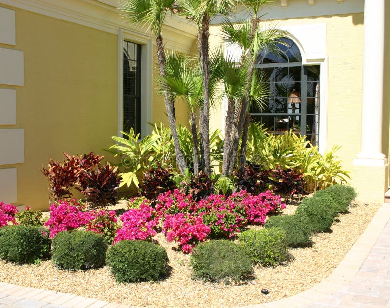 Flower Garden. Garden of flowers in corner near front entrance of home in tropics Flower Garden. Garden of flowers in corner near front entrance of home in tropics