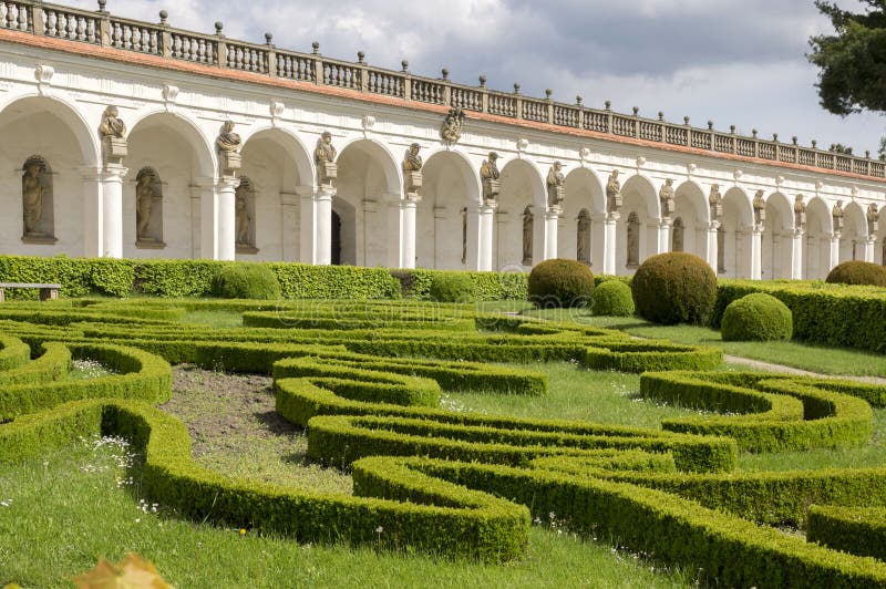 Flower gardens in french style and colonnade building in Kromeriz, Czech republic, Europe