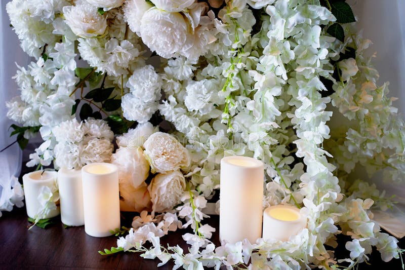 Flower garland of pine-shaped roses hangs from the table.Wedding decoration,floristry royalty free stock photo Flower garland of pine-shaped roses hangs from the table.Wedding decoration,floristry royalty free stock photo