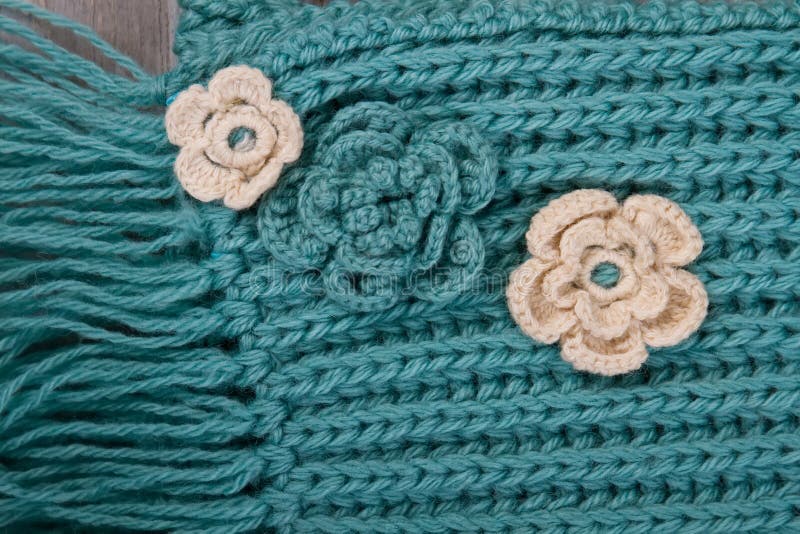 Flower ornaments on turquoise scarf royalty free stock photography Flower ornaments on turquoise scarf royalty free stock photography
