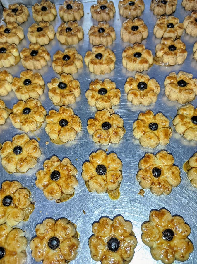 Flower Shaped Cookies with Chocolate Granules in the Middle Stock Image