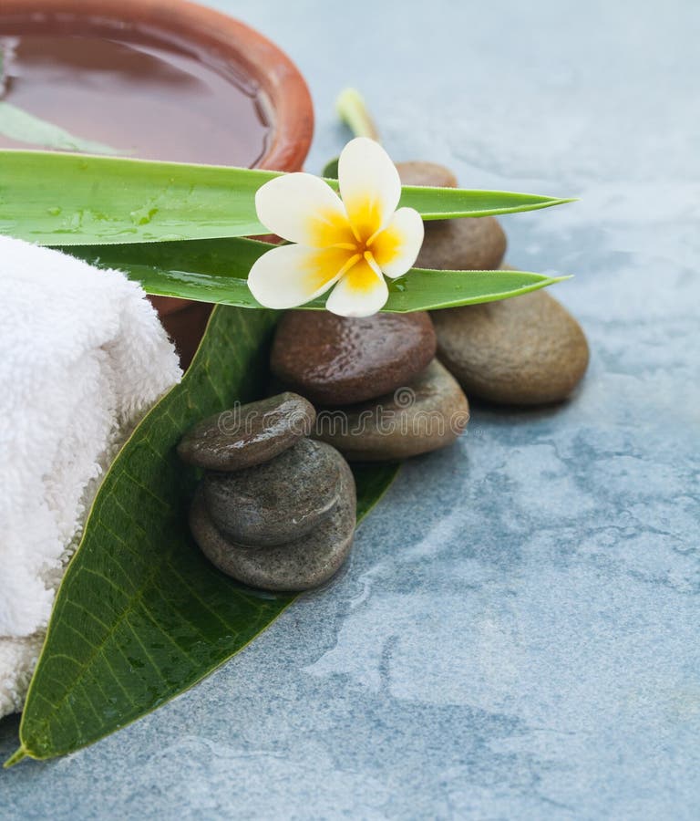 Flower and Spa Objects with Herb in Water for Massage Treatment Stock