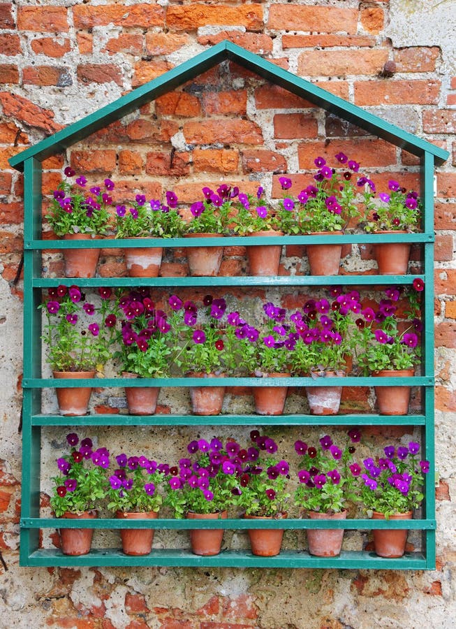 Flowerpots Against a Red Brick Wall Stock Image Image of wall