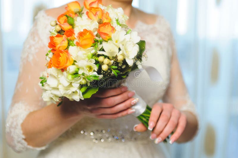 Flowers in Bride s Hands stock photo. Image of ethnicity 63201672