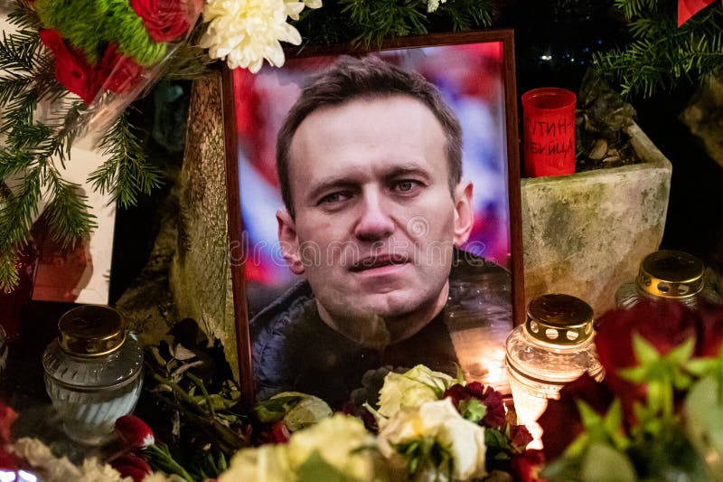 Flowers and candles laid at spontaneous memorial for Russian opposition leader Alexei Navalny