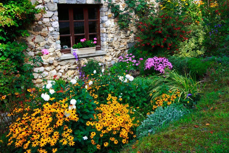 Flowers and stone-built house