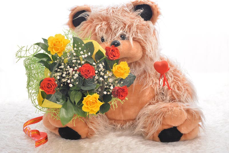 Flowers and a teddy bear stock photo. Image of collection 39817824
