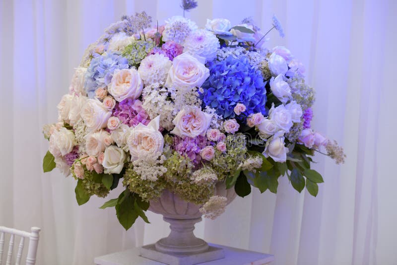 Flowers in a Vase for the Wedding Ceremony. Beautiful Decoration. Stock