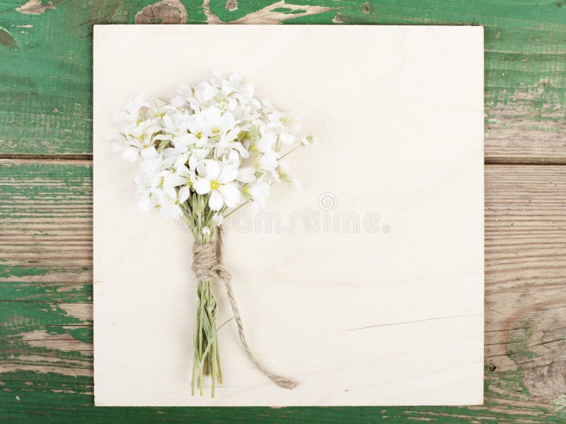 Flowers on vintage wooden planks with blank space